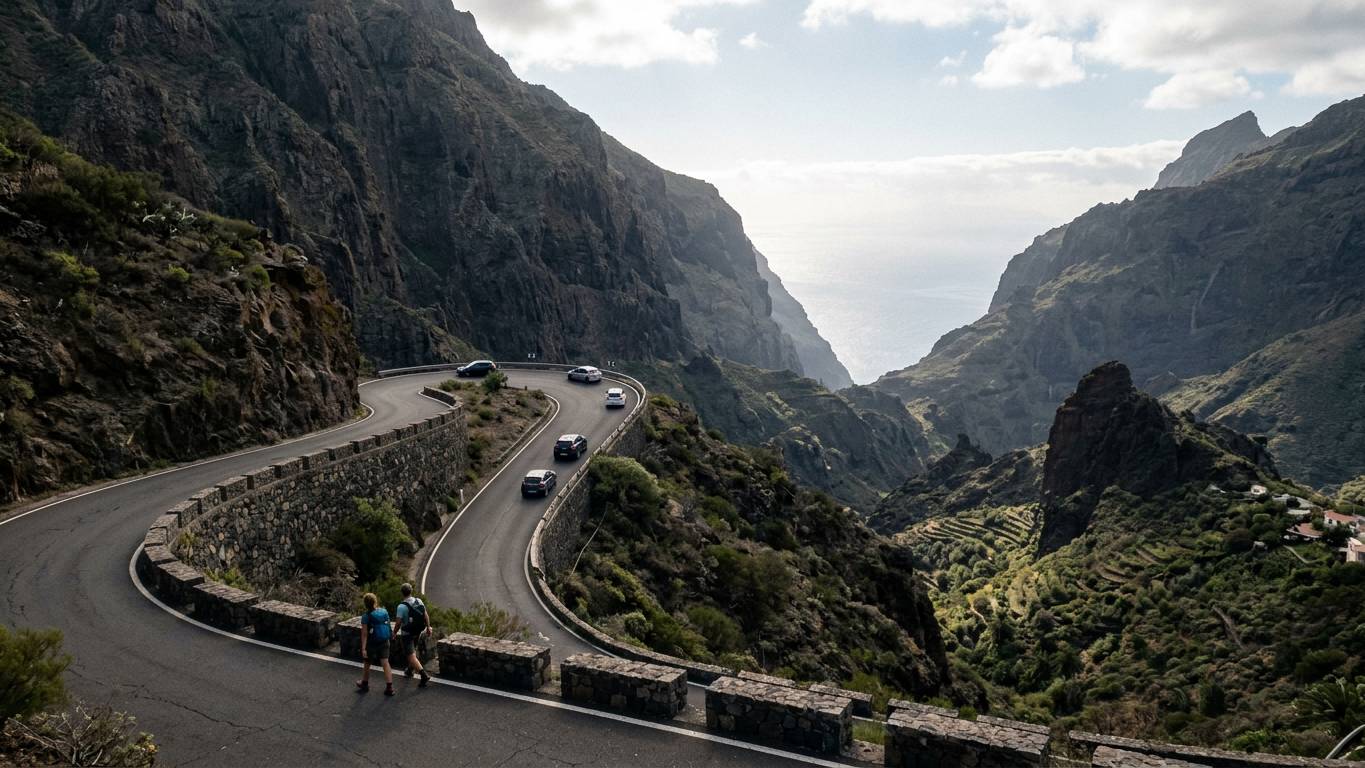 Winding TF-436 mountain road with sharp hairpin bends and ocean below
